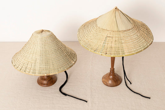 Kuba hats displayed on stands / 石垣島のクバ笠をスタンドに載せて並べた様子